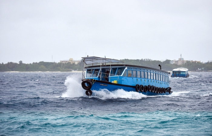 Public ferry in rough weather in Maldives
