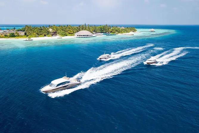 Speedboat transfer in the Maldives approaching a resort jetty
